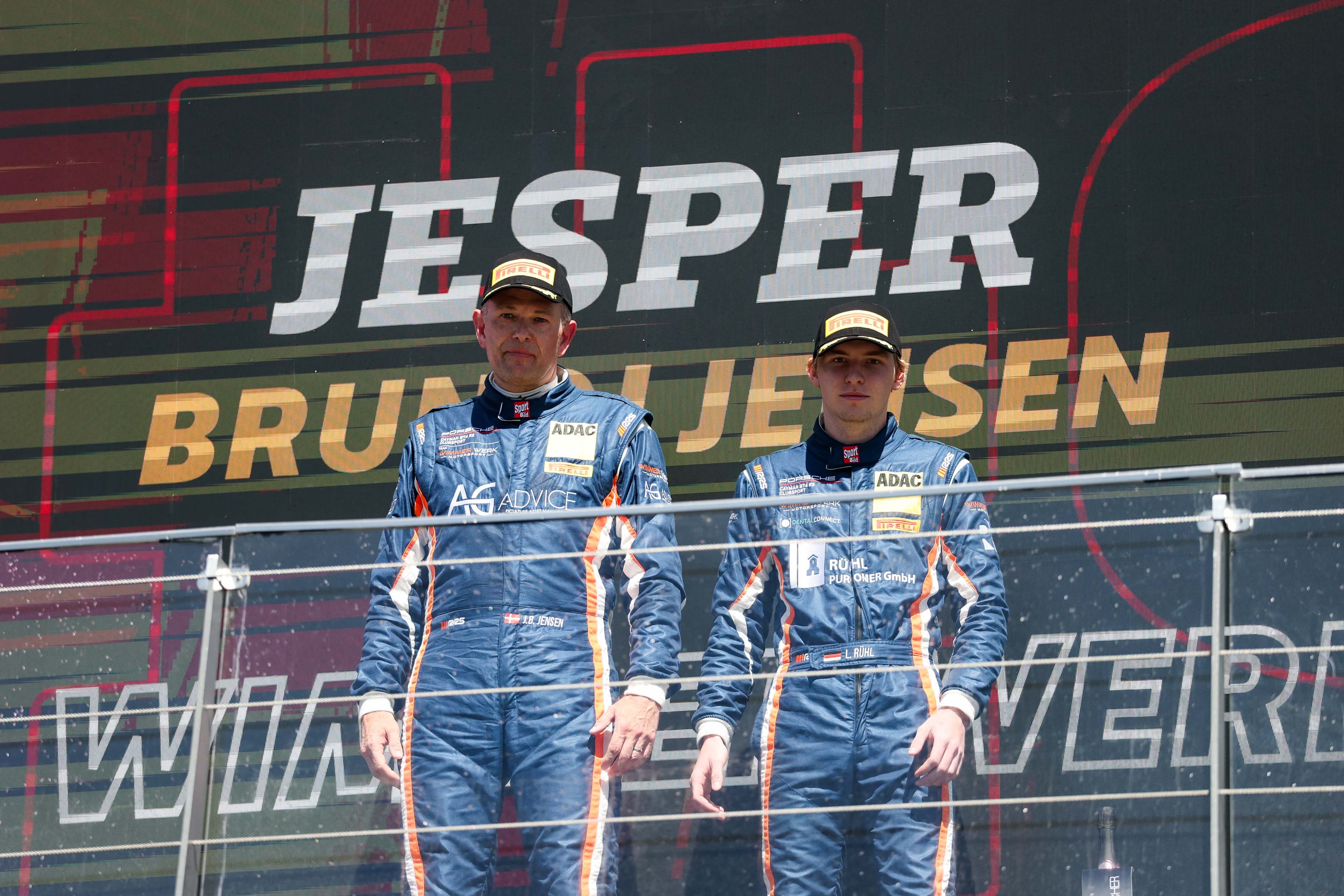 Rühl and Brunhøj Jensen in front of the Wimmer Werk LED board, 2026