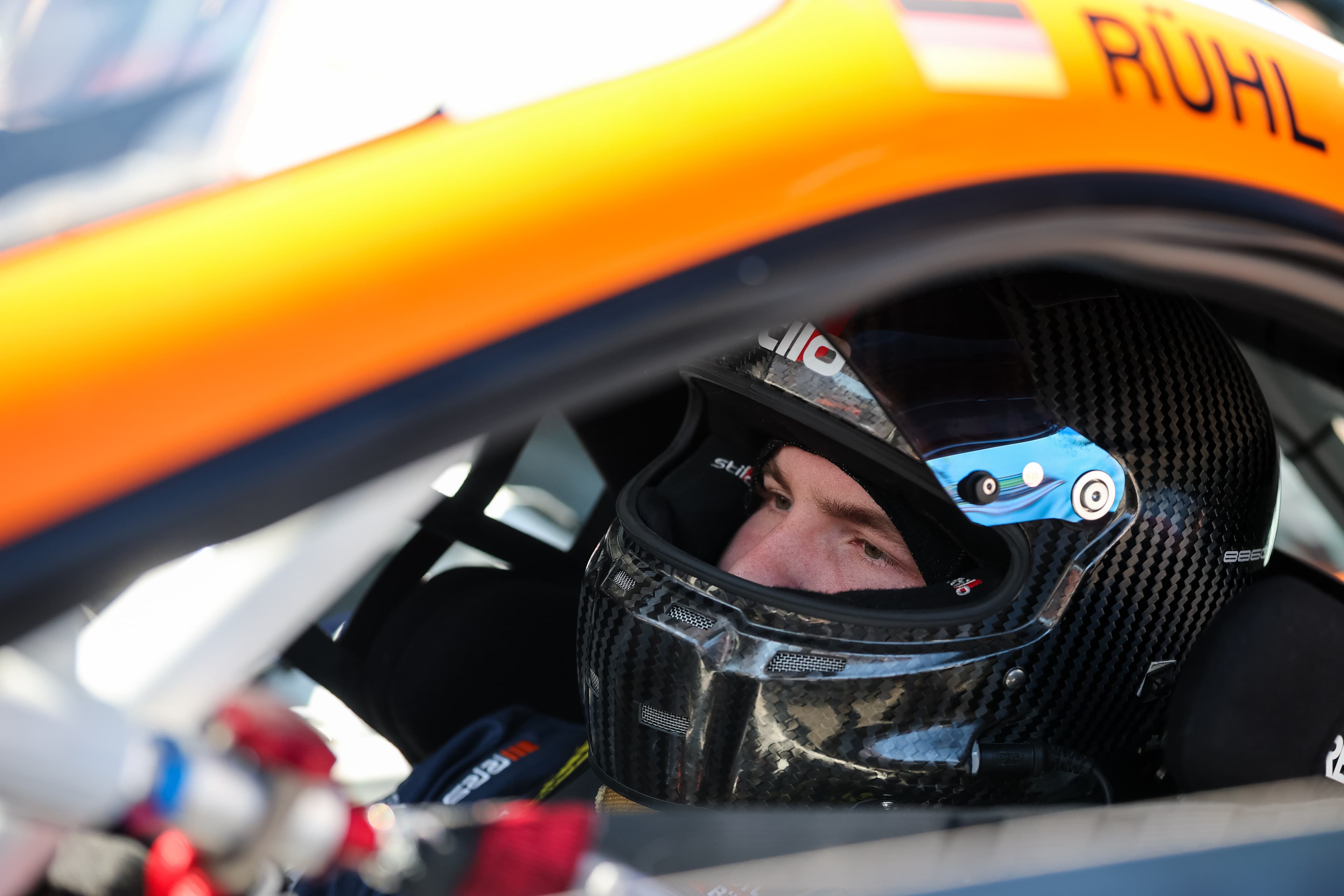 Helmet on in the #91 cockpit, the RÜHL name rail above, Red Bull Ring 2026