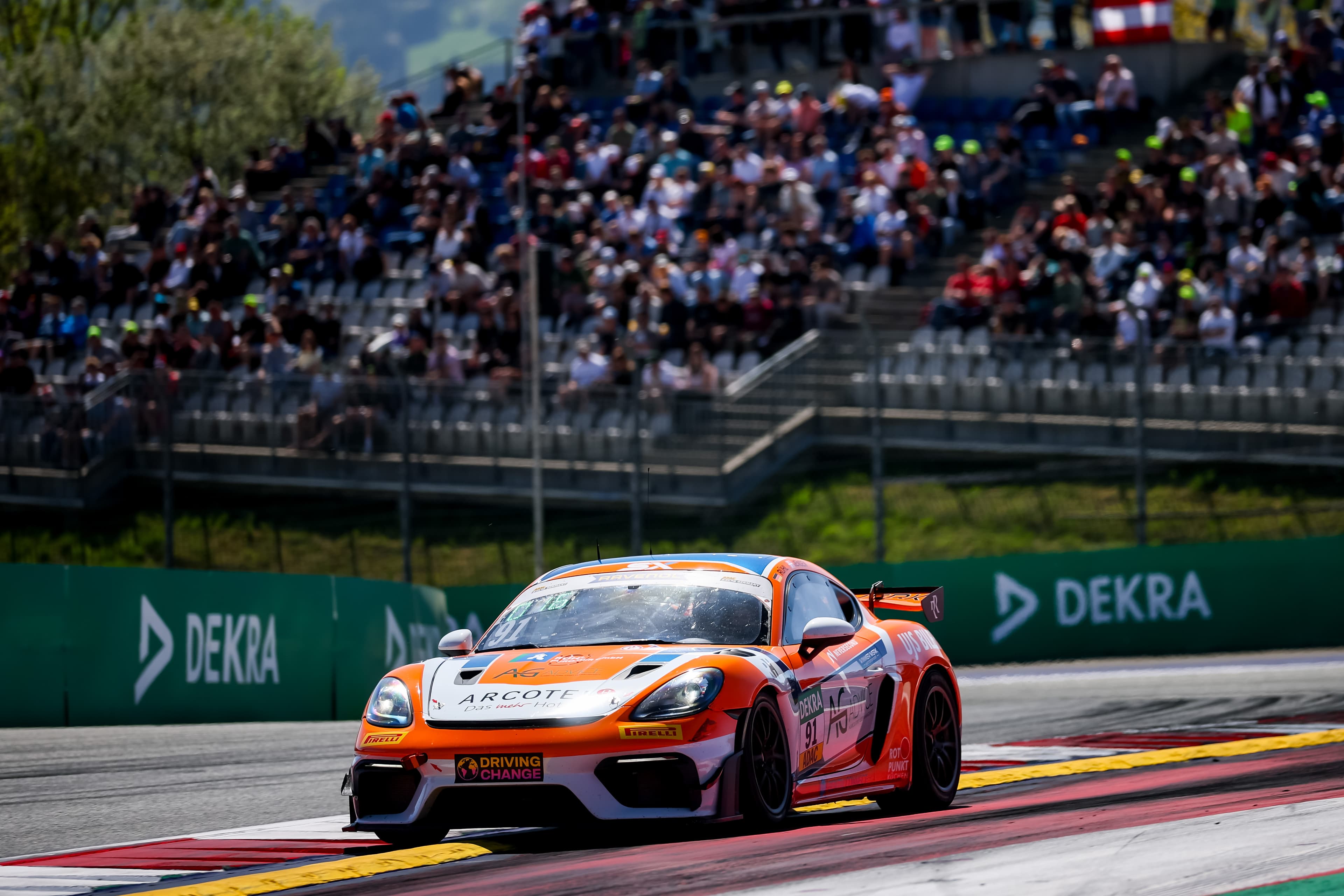 The #91 Porsche in front of a packed Red Bull Ring grandstand, 2026