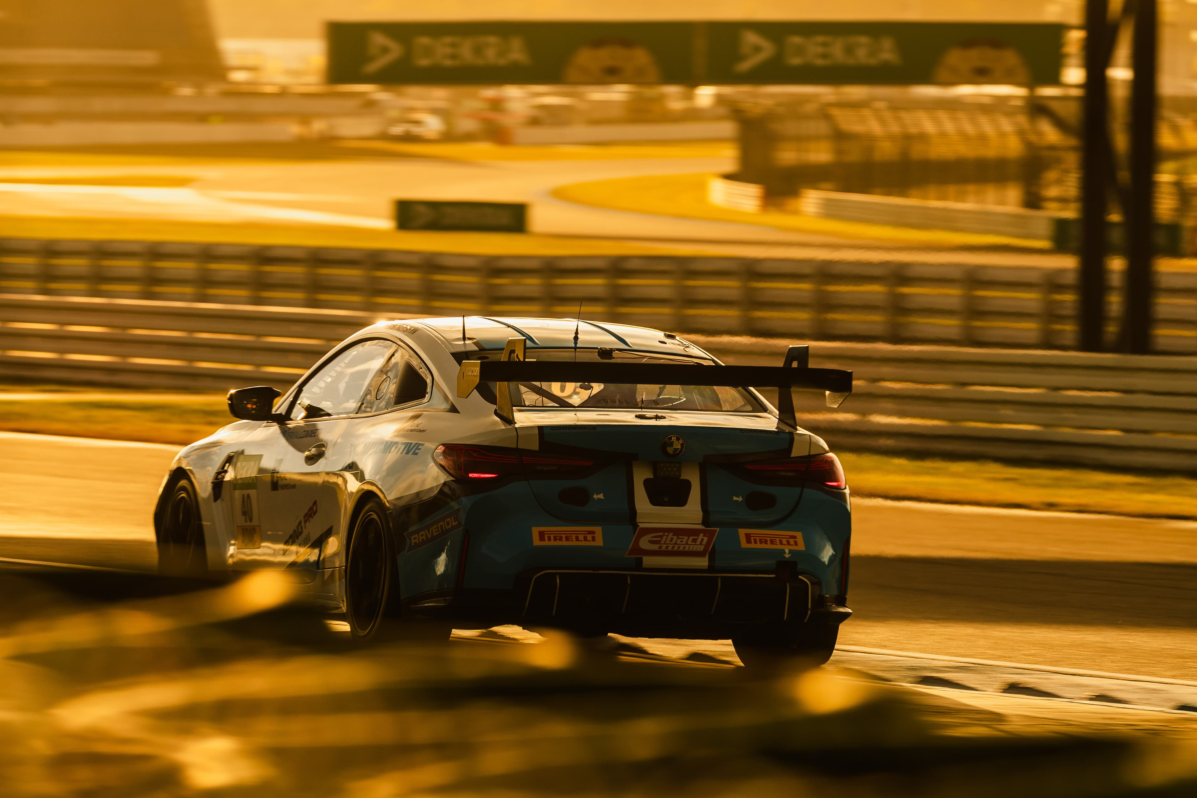 The #40 BMW M4 GT4 Evo at speed in golden evening light, Hockenheim 2025