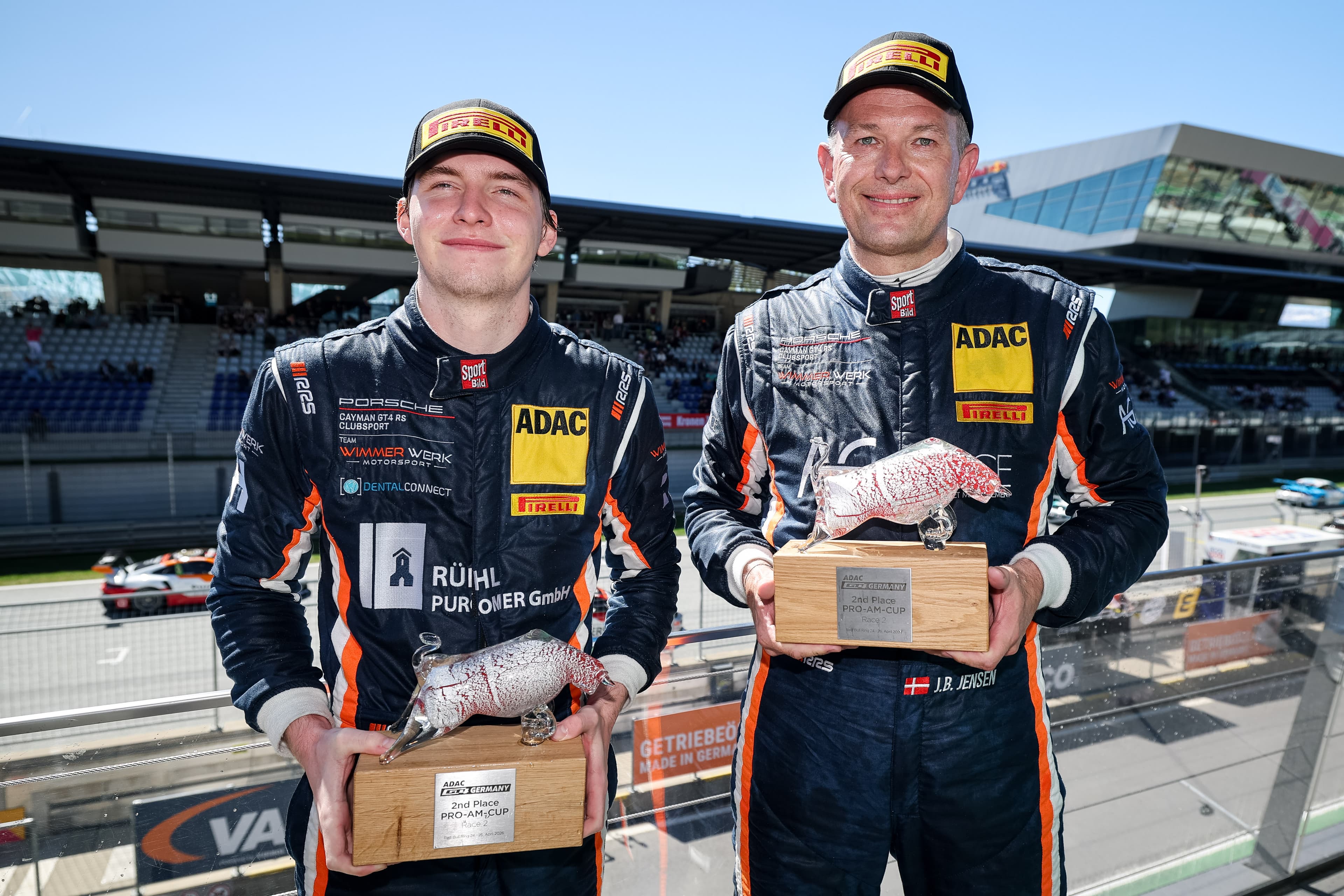 Laurenz Rühl and Jesper Brunhøj Jensen with trophies at the Red Bull Ring, 2026