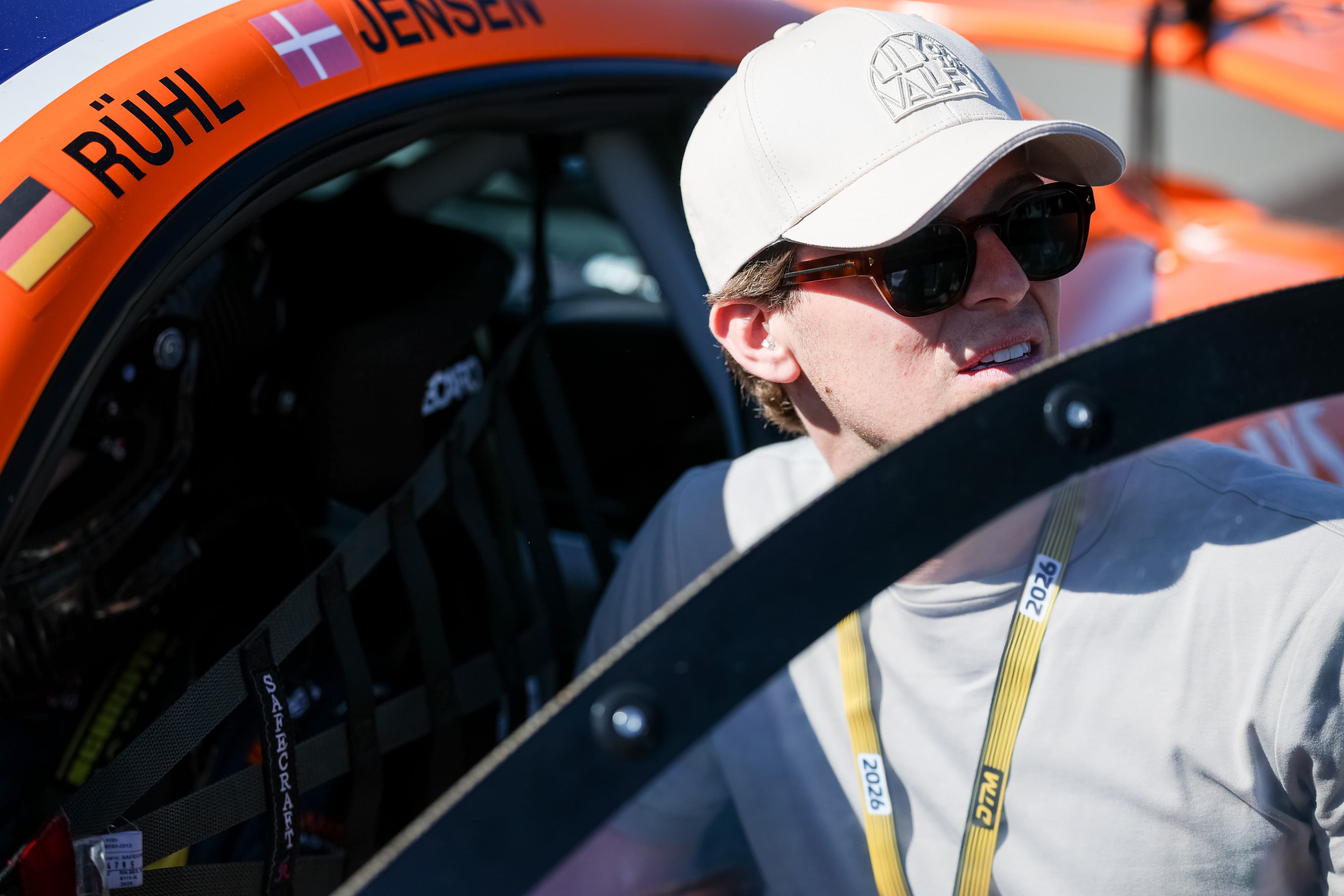 Laurenz Rühl at the #91 door, the Rühl/Jensen name rail on the bodywork, Red Bull Ring 2026