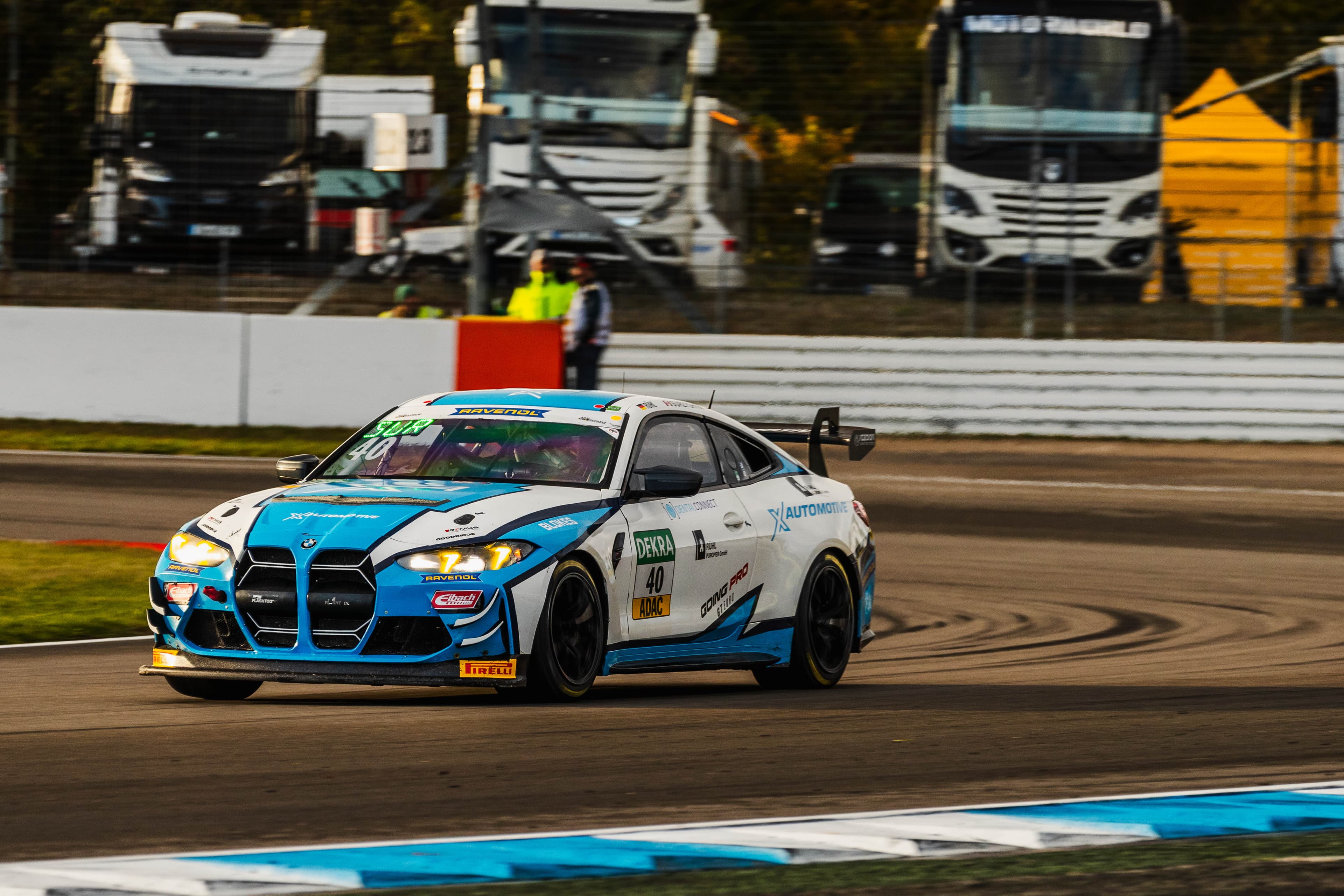 Front three-quarter of the #40 BMW with every partner decal legible
